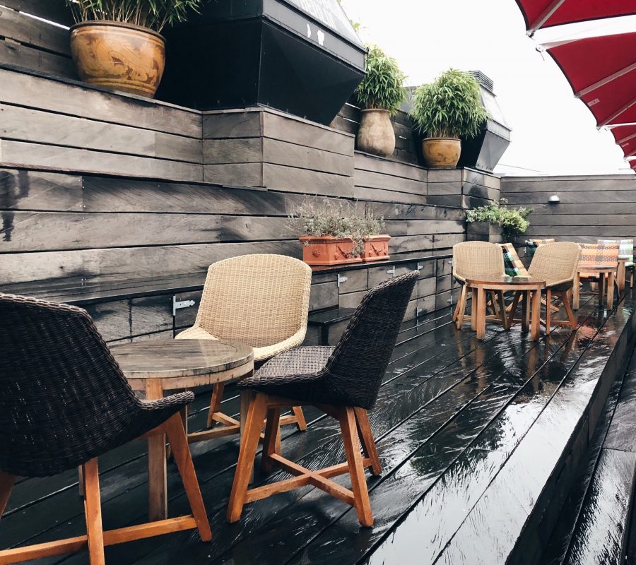 Empty tables and chairs in the hotels rooftop